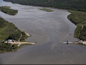 Crews work to clean up an oil spill on the North Saskatchewan river near Maidstone, Sask., on July 22, 2016. Husky Energy has pleaded guilty in a pipeline leak that sent oil spilling into a major river that is the source of drinking water for a number of Saskatchewan communities. The spill into the North Saskatchewan River in July 2016 forced the cities of North Battleford, Prince Albert and Melfort to shut off their water intakes for almost two months.