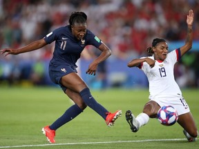 Kadidiatou Diani of France has a shot blocked by Crystal Dunn of the USA during the 2019 FIFA Women's World Cup France Quarter Final match between France and USA at Parc des Princes on June 28, 2019 in Paris, France.