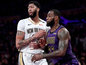 LeBron James of the Los Angeles Lakers guards Anthony Davis of the New Orleans Pelicans at Staples Center on December 21, 2018 in Los Angeles. (Harry How/Getty Images)