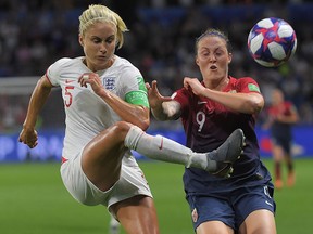 England defender Steph Houghton (left) vies with Norway forward Isabell Herlovsen during the Women's World Cup quarterfinal on June 27, 2019, at the Oceane stadium in Le Havre, France. (LOIC VENANCE/AFP/Getty Images)