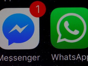 WhatsApp and Facebook messenger icons are seen on an iPhone in Manchester , Britain March 27, 2017.