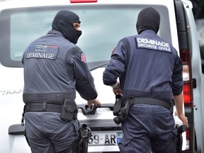 Bomb-disposal experts work outside a residence in Oullins, near Lyon, France, on May 27, 2019.