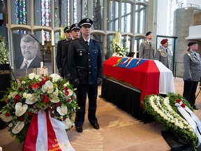An honour guard made of Police and Federal Armed Force officers stands next to the coffin of the Kassel District President, Walter Luebcke, who was shot, during his funeral at the St. Martin Church in Kassel, Germany, June 13, 2019. (Swen Pfoertner/REUTERS)