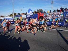 Women run during the 2018 TCS New York City Marathon in New York on November 4, 2018.