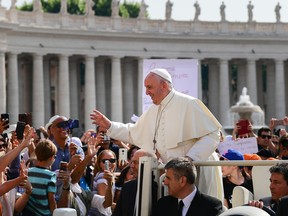 Pope Francis waves to worshipers as he arrives for the weekly general audience on June 5, 2019 at St. Peter's square in the Vatican.