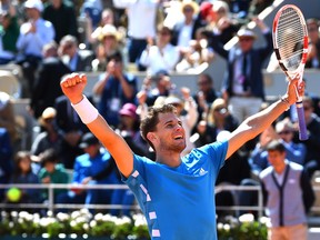 Dominic Thiem of Austria celebrates at match point during his mens singles semi-final match against Novak Djokovic of Serbia during Day fourteen of the 2019 French Open at Roland Garros on June 8, 2019 in Paris. (Clive Mason/Getty Images)