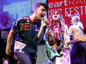 LAS VEGAS, NV - SEPTEMBER 19:  (L-R) Joe Jonas, JinJoo Lee, and Cole Whittle of DNCE perform during the 2015 iHeartRadio Music Festival After Party at Light Nightclub on September 19, 2015 in Las Vegas, Nevada.