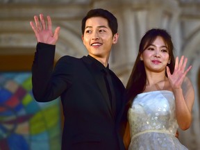 South Korean actor Song Song Joong-Ki and actress Song Hye-Kyo pose for a photo call on the red carpet of the 52nd annual BaekSang Art Awards in Seoul on June 3, 2016. (JUNG YEON-JE/AFP/Getty Images)