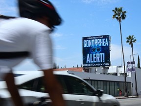 A billboard from the AIDS Healthcare Foundation (AHF) is seen on Sunset Boulevard in Hollywood, California on May 29, 2018 warning of a drug resistant Gonorrhea. (FREDERIC J. BROWN/AFP/Getty Images)
