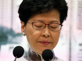 Hong Kong Chief Executive Carrie Lam looks down during a news conference in Hong Kong, China, June 15, 2019.