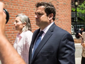 Former Stanford University sailing coach John Vandemoer walks into the John Joseph Moakley Courthouse in Boston on Wednesday, June 12, 2019.