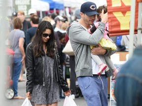 Ashton Kutcher and Mila Kunis take their daughter Wyatt to the Farmers Market in Los Angeles on May 29, 2016.