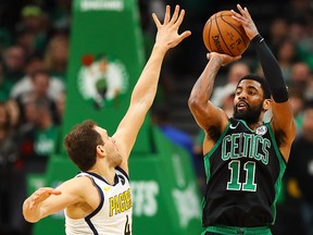 Kyrie Irving of the Boston Celtics shoots the ball over Bojan Bogdanovic of the Indiana Pacers at TD Garden on April 14, 2019 in Boston. (Adam Glanzman/Getty Images)