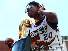 Kyle Lowry of the Toronto Raptors holds the championship trophy during the team's victory parade on June 17, 2019 in Toronto. (Vaughn Ridley/Getty Images)