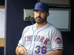 Mets manager Mickey Callaway stands in the dugout before a game against the Braves at SunTrust Park in Atlanta on June 18, 2019.