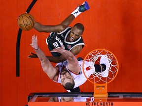 Khris Middleton of the Milwaukee Bucks shoots the ball against Marc Gasol of the Toronto Raptors in Game 3 of the NBA Eastern Conference Finals at Scotiabank Arena on May 19, 2019 in Toronto. (Vaughn Ridley/Getty Images)