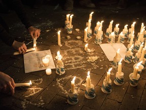 A makeshift memorial is made during a vigil at the University of North Carolina following the murders of three Muslim students on February 11, 2015 in Chapel Hill, North Carolina. (BRENDAN SMIALOWSKI/AFP/Getty Images)