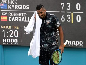 Australia's Nick Kyrgios plays against Spain's Roberto Carballes Baena during his first-round match at The Queen's Club in London on Thursday, June 20, 2019.