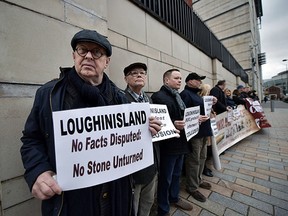 Loughinisland victim protesters stand alongside Ballymurphy victim supporters at Belfast High Court on January 12, 2018 in Belfast, Northern Ireland. (Charles McQuillan/Getty Images)