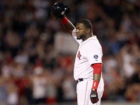 Boston Red Sox designated hitter David Ortiz salutes the crowd after getting his 2,000th career hit against the Detroit Tigers in Boston, September 4, 2013. (REUTERS/Dominick Reuter/File Photo)