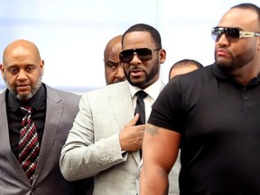 R. Kelly walks inside the Criminal Court Building as he arrives for a hearing on eleven new counts of criminal sexual abuse,  in Chicago, Illinois, U.S., June 6, 2019.