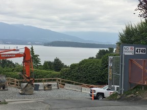 Construction crews are working on the home at 4749 Belmont Ave., which is not visible from the street. The owner is suing the city for applying the empty homes tax on the property even as she waited on the city for permits to do a reconstruction.