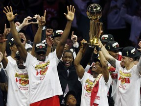 Raptors president Masai Ujiri celebrates with the players after being crowned NBAchampions following a 114-110 win over the Warriors in Game 6 on Thursday night in Oakland. (GETTY IMAGES