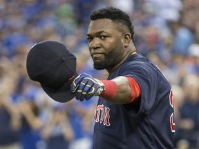 David Ortiz salutes the fans after getting a gift before the game between the Toronto Blue Jays and  Boston Red Sox in Toronto, Ont. on Friday September 9, 2016.