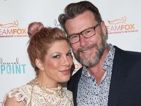 Tori Spelling and Dean McDermott arrive at the Raising The Bar To End Parkinson's event on July 27, 2016.
