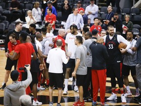 Raptors players gather at centre court after practice in Toronto on Saturday. Game 2 goes Sunday night. (JACK BOLAND/TORONTO SUN)