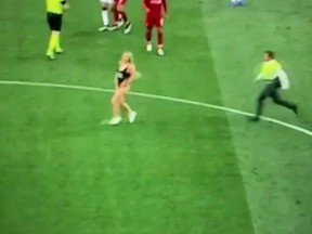 A female streaker charges onto the pitch during Saturday's Champions League final between Liverpool FC and Tottenham Hotspur. (Twitter screengrab)