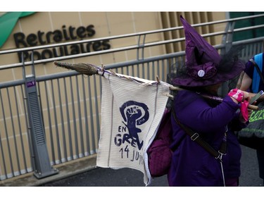 People protest on a bridge during a day-long and nationwide women's strike aimed at highlighting the country's poor record on defending the rights of women and families in Lausanne, Switzerland, June 14, 2019.