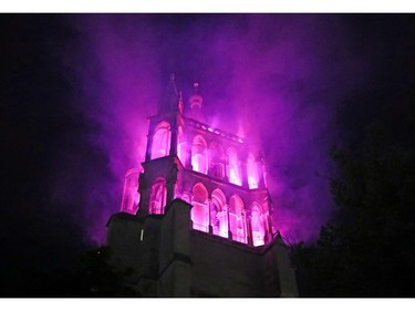 The Cathedral is lit in purple, the official color of the movement, at the start of a day-long and nationwide women's strike aimed at highlighting the country's poor record on defending the rights of women and families in Lausanne, Switzerland, June 14, 2019.