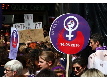 Placards are seen as people attend a day-long and nationwide women's strike aimed at highlighting the country's poor record on defending the rights of women and families in Lausanne, Switzerland, June 14, 2019.