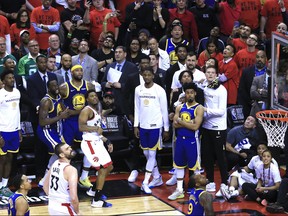 Kyle Lowry (7), along with Warriors bench, watches as his ball misses the net as the Raptors lose by one point to the Golden State Warriors in Game 5 of the NBA Finals at Scotiabank Arena, in Toronto, Ont. on Monday June 10, 2019. Stan Behal/Toronto Sun/Postmedia Network