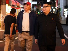 An impersonator of North Korean leader Kim Jong Un and a Donald Trump impersonator walk in a street of Osaka during the G20 Summit on June 28, 2019. (CHARLY TRIBALLEAU/AFP/Getty Images)