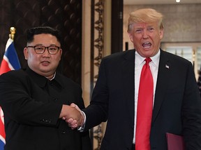 In this file photo taken on June 12, 2018, U.S. President Donald Trump and North Korea's Kim Jong Un shake hands following a signing ceremony during their historic US-North Korea summit. (SAUL LOEB/AFP/Getty Images)