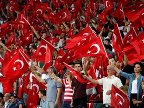 General view of Turkey fans with flags inside the stadium before a match. (REUTERS/Umit Bektas/File Photo)