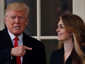U.S. President Donald Trump and former White House Communications Director Hope Hicks outside the Oval Office in Washington D.C., U.S., March 29, 2018.