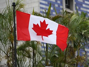 The Canadian flag flies outside the Canadian Embassy in Caracas on June 3, 2019. - Canada announced Sunday it was temporarily shutting its embassy in Venezuela, blaming President Nicolas Maduro for refusing to accredit diplomats critical of his regime.