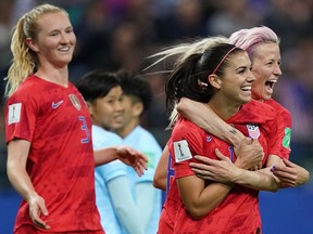 United States' forward Alex Morgan (2R) and United States' forward Megan Rapinoe (R) celebrate a goal during the France 2019 Women's World Cup Group F football match between USA and Thailand, on June 11, 2019, at the Auguste-Delaune Stadium in Reims, eastern France.
