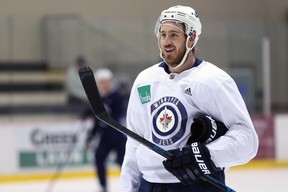 Kevin Hayes smiles at a teammate during Winnipeg Jets practice at Bell MTS Iceplex on Monday, April 8