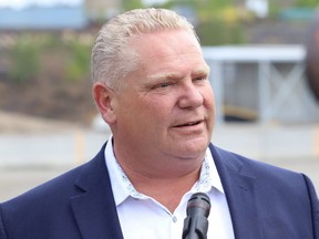 Ontario Premier Doug Ford answers questions from reporters during a visit to Lopes Ltd. in Coniston, Ont., on June 19, 2019.