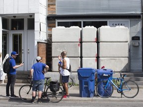 Concrete barriers bar entry to an illegal pot dispensary at 104 Harbord St. in Toronto on Friday, July 19, 2019.