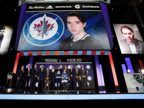 VANCOUVER, BRITISH COLUMBIA - JUNE 21: Ville Heinola reacts after being selected twentieth overall by the Winnipeg Jets during the first round of the 2019 NHL Draft at Rogers Arena on June 21, 2019 in Vancouver, Canada. (Photo by Bruce Bennett/Getty Images)