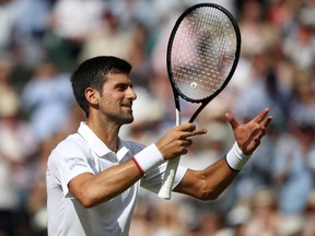 Novak Djokovic of Serbia celebrates victory in his Men's Singles semifinal match against Roberto Bautista Agut of Spain during Day eleven of The Championships - Wimbledon 2019 at All England Lawn Tennis and Croquet Club on July 12, 2019 in London, England.
