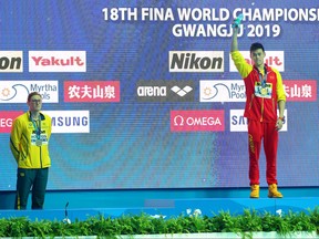Silver medalist Mack Horton of Australia and gold medalist Sun Yang of China pose during the medal ceremony for Men's 400m Freestyle Final on day one of the Gwangju 2019 FINA World Championships at Nambu International Aquatics Centre on July 21, 2019 in Gwangju, South Korea. (Maddie Meyer/Getty Images)