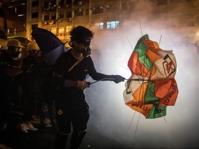 Protesters clash with police amid tear gas after taking part in an anti-extradition bill march on July 21, 2019 in Hong Kong. (Chris McGrath/Getty Images)