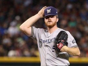 tarting pitcher Brandon Woodruff #53 of the Milwaukee Brewers reacts after giving up a two-run home run to Alex Avila (not pictured) of the Arizona Diamondbacks during the second inning of the MLB game at Chase Field on July 21, 2019 in Phoenix, Arizona.