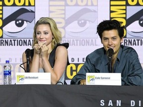 Lili Reinhart and Cole Sprouse speak at the "Riverdale" Special Video Presentation and Q&A during 2019 Comic-Con International at San Diego Convention Center on July 21, 2019 in San Diego, Calif.